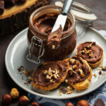Homemade hazelnut spread with chocolate with slices toast